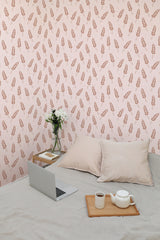 Self-adhesive wallpaper with a Bakery design, featuring a pattern of wheat stalks in a light brown shade against a soft pink background, creating a cozy, rustic ambiance in the room.