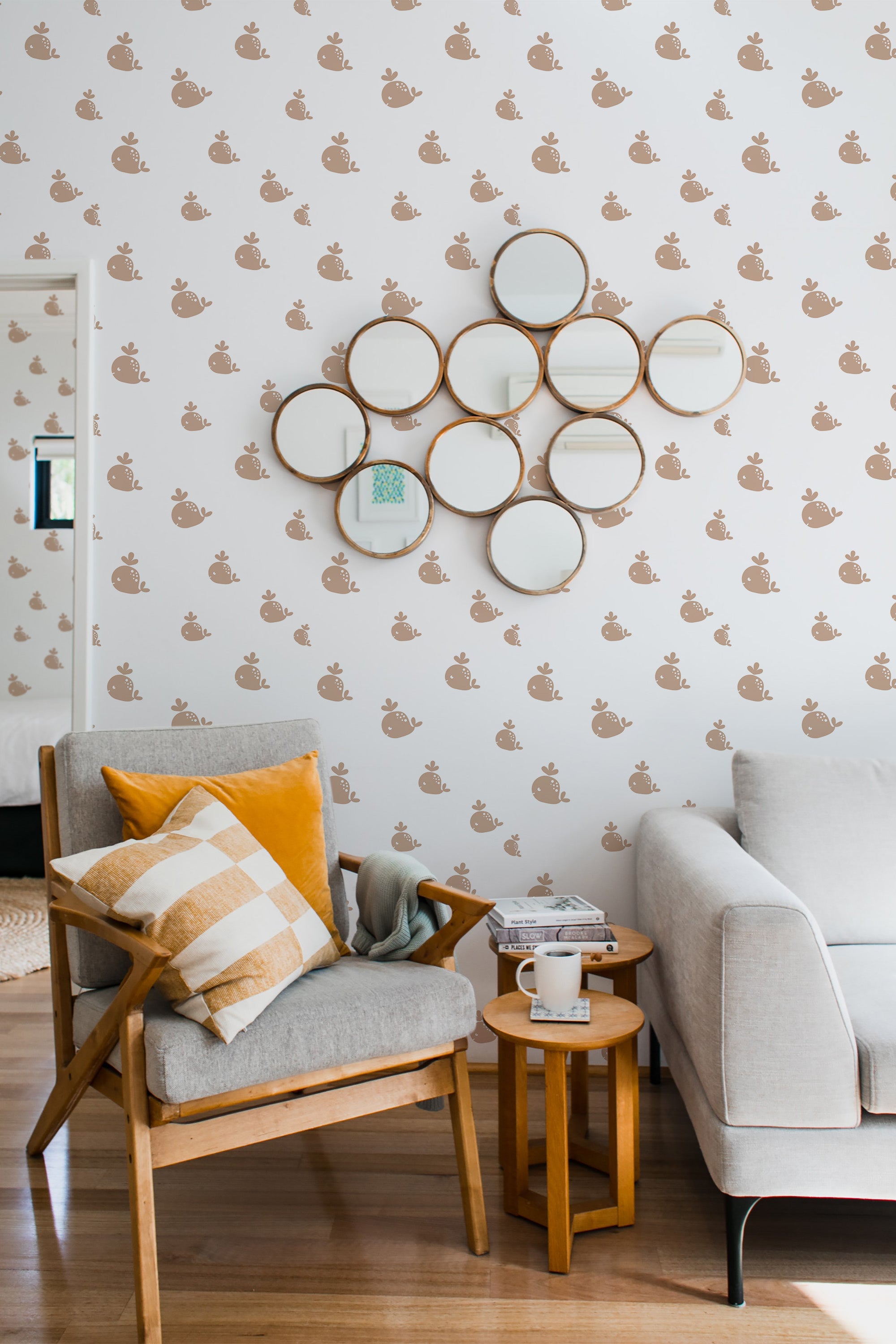 Wallpaper design with small, repeating whale motifs in a muted brown tone on a white background, creating a subtle marine-themed pattern in a cozy, modern living space, traditional wallpaper.