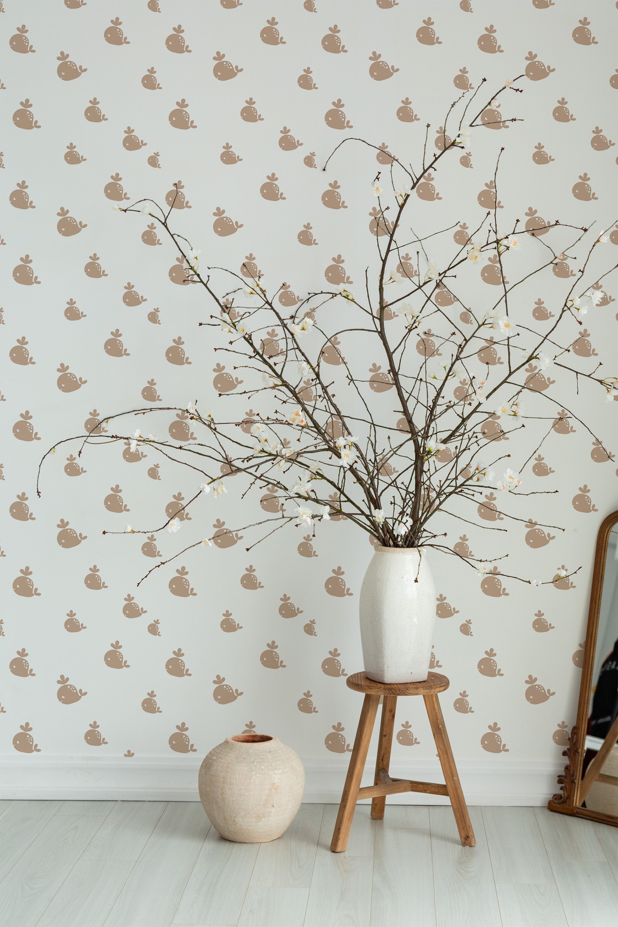 Self-adhesive wallpaper with a charming Small whale design, repetitive pattern of simple, stylized whales in soft brown tones on a light cream background.