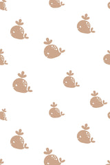 A repeating pattern of whimsical, simplistic brown whales with small dorsal fins and white spots on a clean white background, peel and stick removable wallpaper.