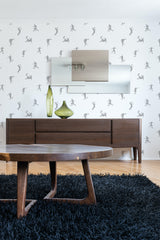 Room with white wallpaper adorned with repetitive gray football player icons in action poses, creating a dynamic and lively ambiance. Traditional wallpaper.