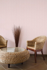 Self-adhesive wallpaper with a soft pink herringbone pattern, creating a subtle, elegant texture.