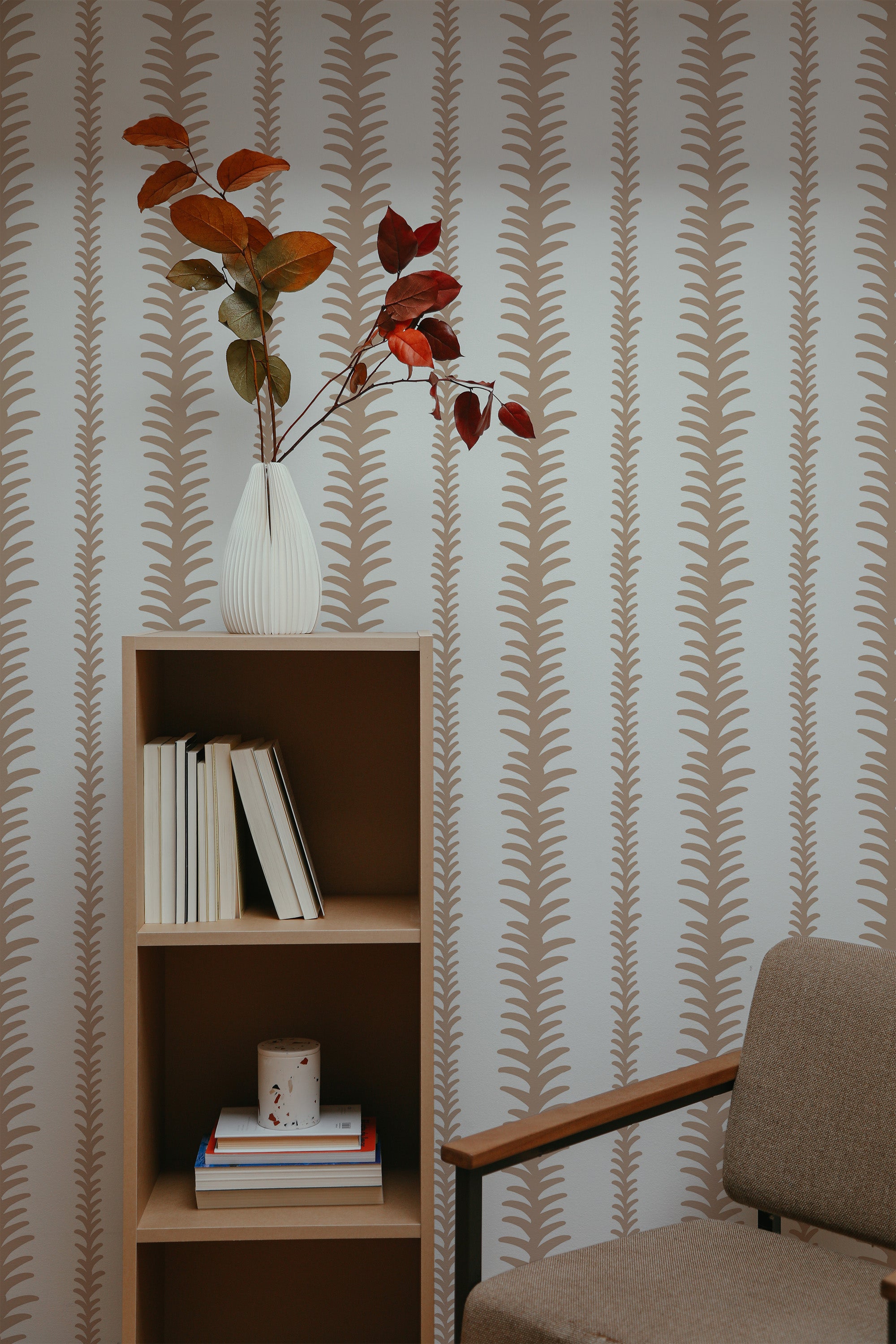 Self-adhesive wallpaper with an abstract stripe design, featuring vertical rows of organic, fern-like shapes in a muted beige color on a white background.
