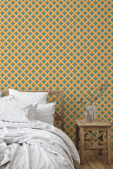 Self-adhesive wallpaper with an orange retro design of interlacing diamond patterns in bold orange and teal tones, creating a vibrant and geometric backdrop.