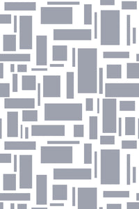 A geometric pattern with various sizes of gray rectangular shapes scattered on a white background, peel and stick removable wallpaper.