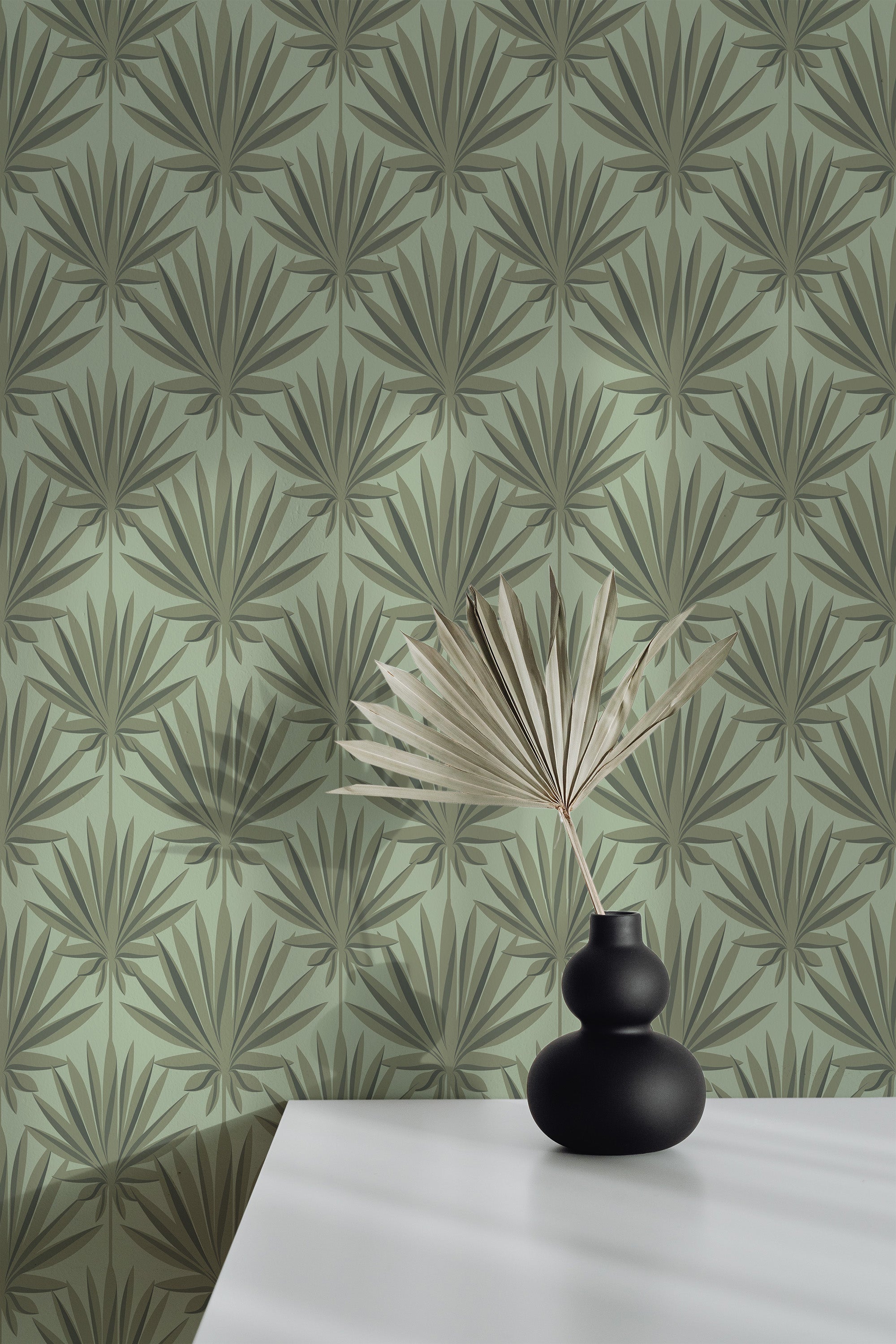 Self-adhesive wallpaper with a French palm design, featuring a repeated pattern of stylized palm leaves in muted green and brown tones on a light green background.