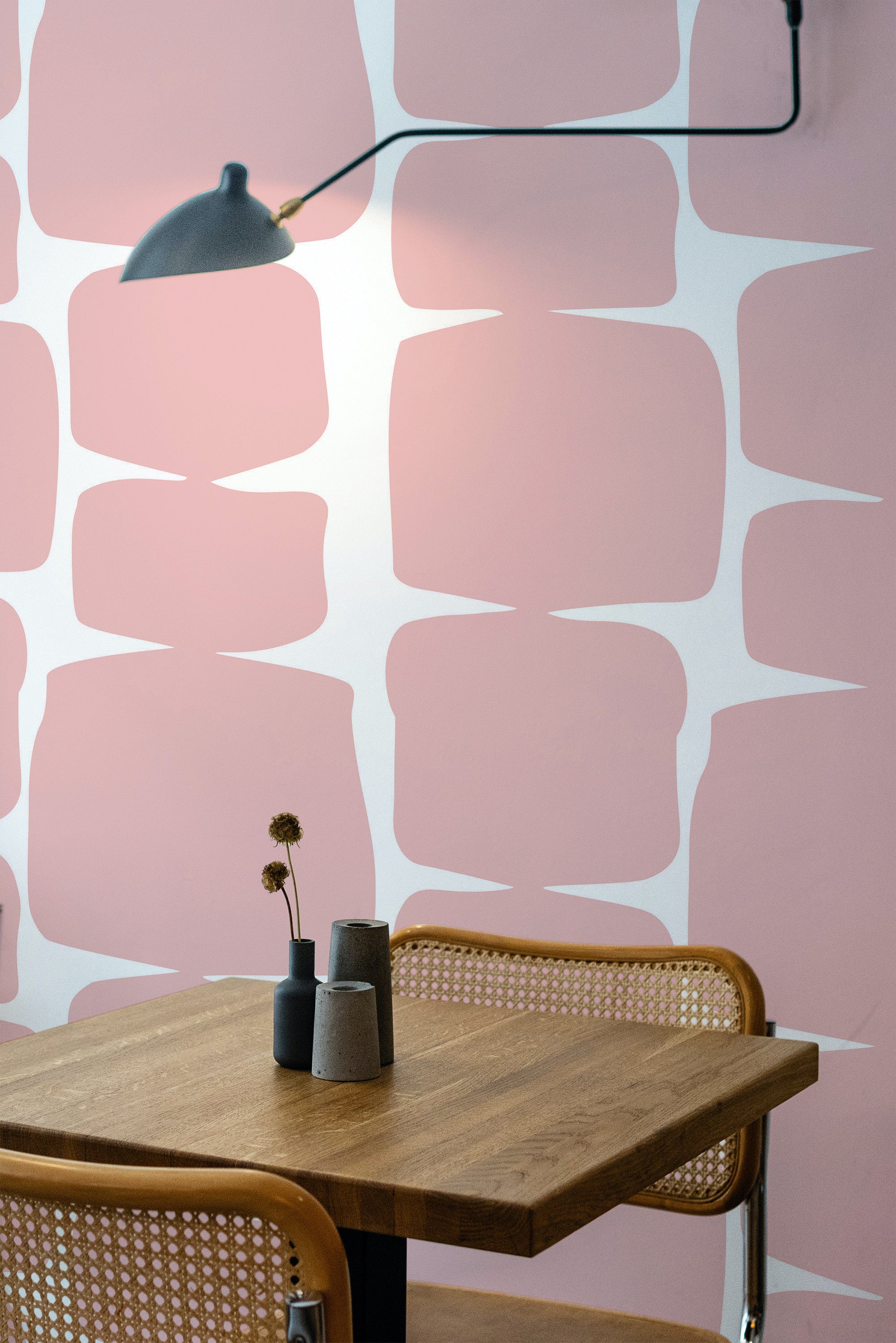Self-adhesive wallpaper with a pink retro shape design, characterized by large, organic pink forms with curved edges against a white background.