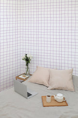 Self-adhesive grid print wallpaper with thin, irregular purple lines creating a simple, modern geometric pattern on a white background.