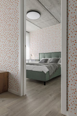 Wallpaper with a pattern of small, evenly spaced orange spots on a white background, giving the room a playful yet simple and elegant appearance,raditional wallpaper.