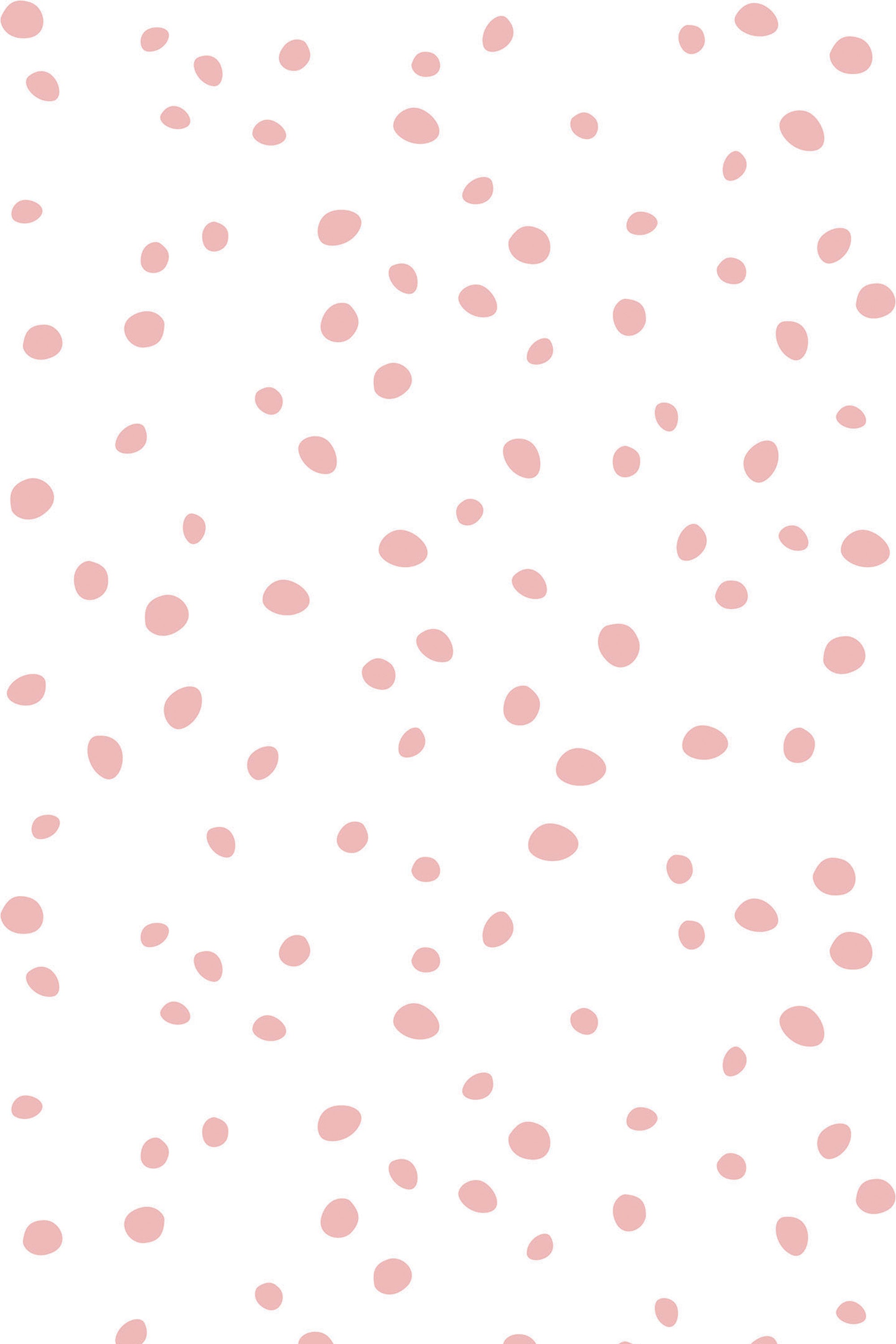 Dalmatian dots pattern with irregular, scattered pink dots on a white background, peel and stick removable wallpaper.