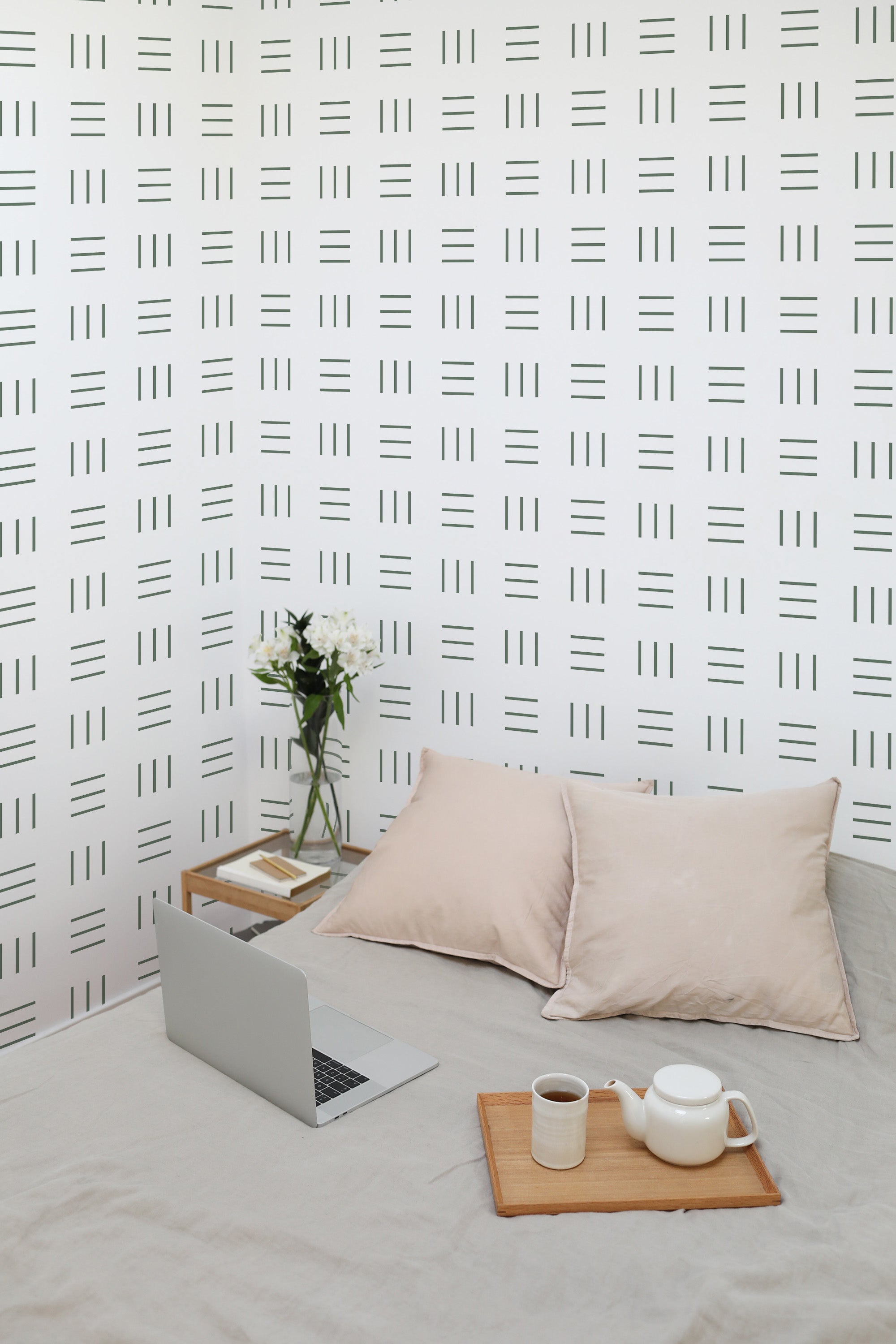 Self-adhesive wallpaper with a minimal geometric lines pattern in black arranged in a grid on a white background, creating a modern, clean aesthetic.