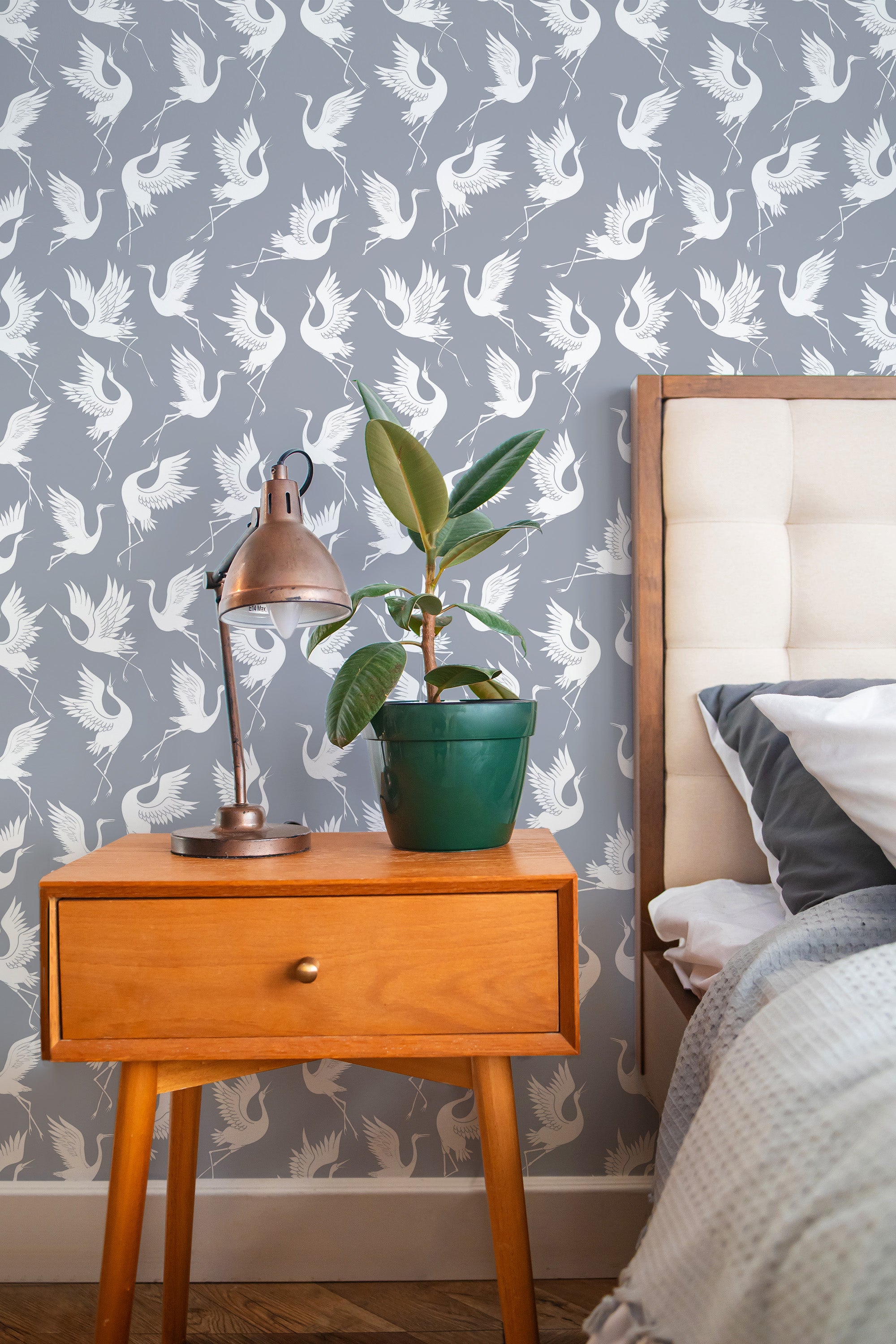 Self-adhesive wallpaper with a Swan print design, showing elegant white swans in various graceful poses on a grey background, adding a touch of serenity and sophistication to the room.