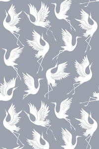 White swans with outstretched wings in various positions create a repeating pattern on a gray background. Peel and stick removable wallpaper.