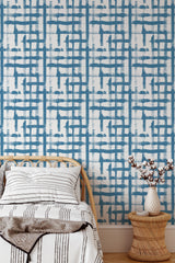 Self-adhesive wallpaper with a blue grid pattern, featuring intersecting vertical and horizontal lines in various shades, creating a modern, geometric design on a white background.