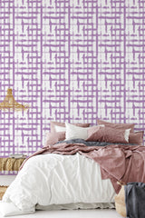 The wallpaper has a bold brush stroke design in purple with interconnected rectangular patterns on a white background, giving a contemporary yet timeless feel to the traditional wallpaper.