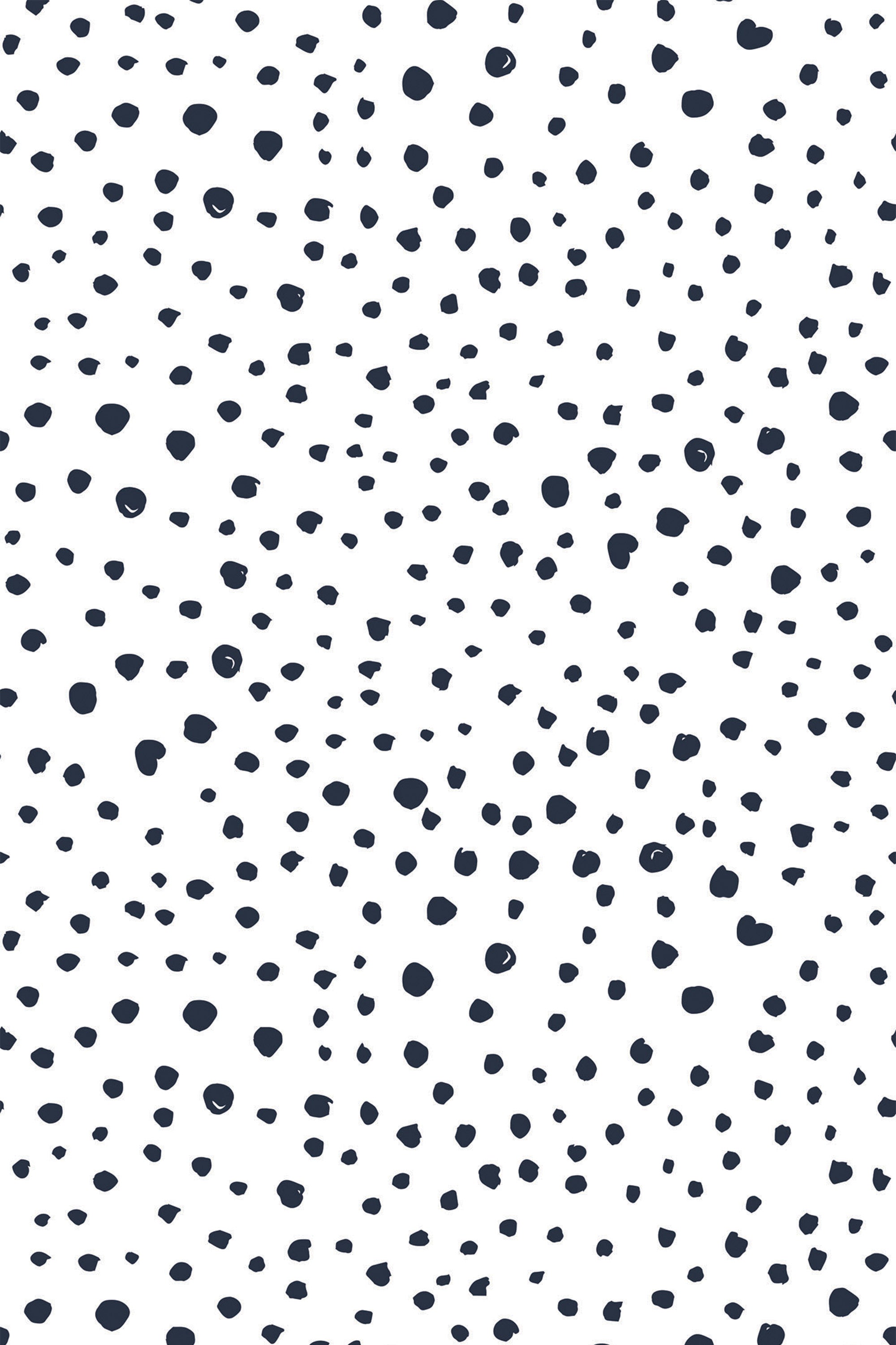Dalmatian print design with scattered irregular black spots on a white background, peel and stick removable wallpaper.