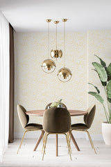 Wallpaper with a pattern of tiny speckled dots in muted tones, adding a subtle, textured accent to the room. Traditional wallpaper.