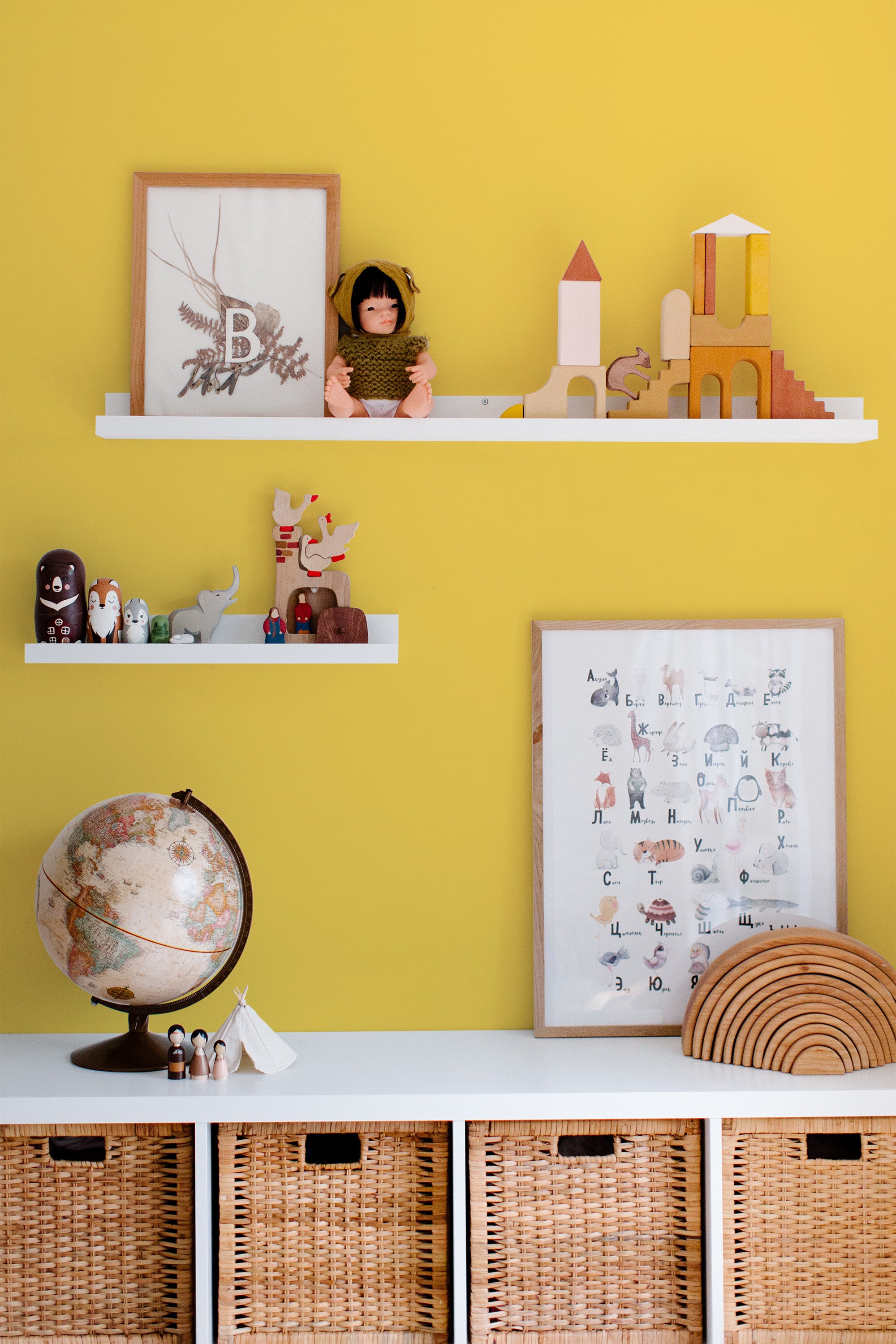 Self-adhesive wallpaper with a simple, solid yellow color seamlessly covering the room's wall, providing a vibrant and cheerful atmosphere, ideal for a playful and creative space.