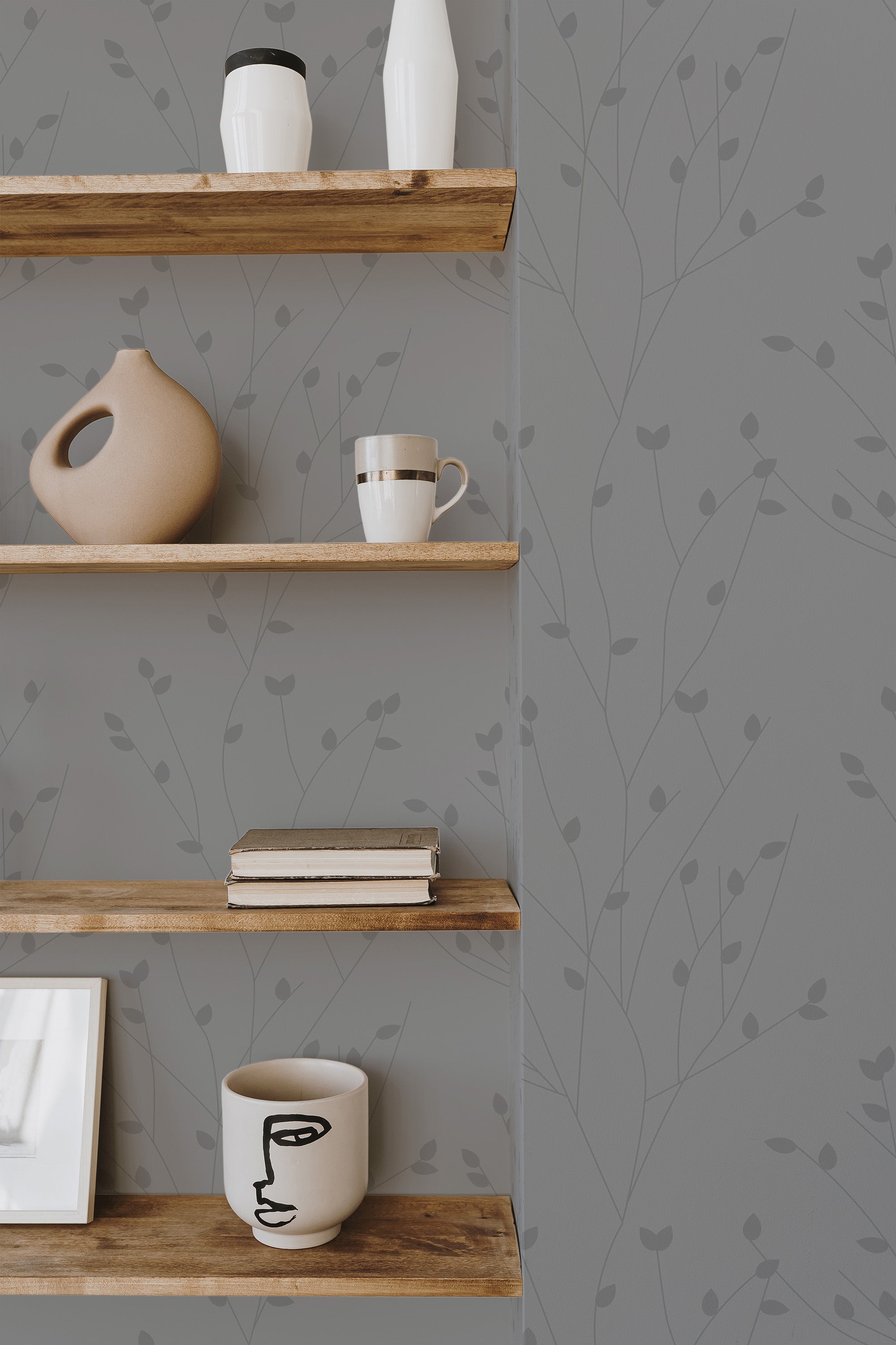 Self-adhesive wallpaper with a minimal tree design in light gray, featuring delicate, small branches and leaves spread across the wall, creating a subtle and calming natural ambiance.