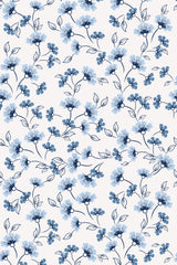 A repeating wallpaper pattern featuring delicate blue and light blue floral designs with intricate petal and leaf details on a light background. Peel and stick removable wallpaper.