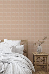 Self-adhesive wallpaper with a Minimal tile design in soft, neutral tones. The pattern is made up of subtle, geometric shapes that create a modern and understated look. The wallpaper complements the light wooden furniture and adds a stylish touch to the cozy bedroom setting.