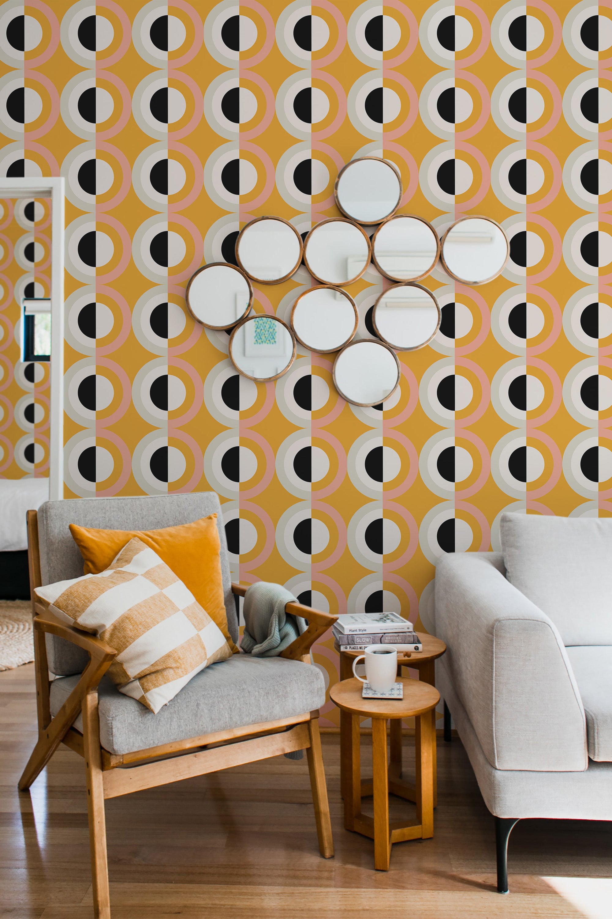 Orange bold retro wallpaper with repetitive circular patterns of white, black, and yellow, creating a vibrant, retro-inspired geometric design that enhances the room's modern yet vintage aesthetic,raditional wallpaper.