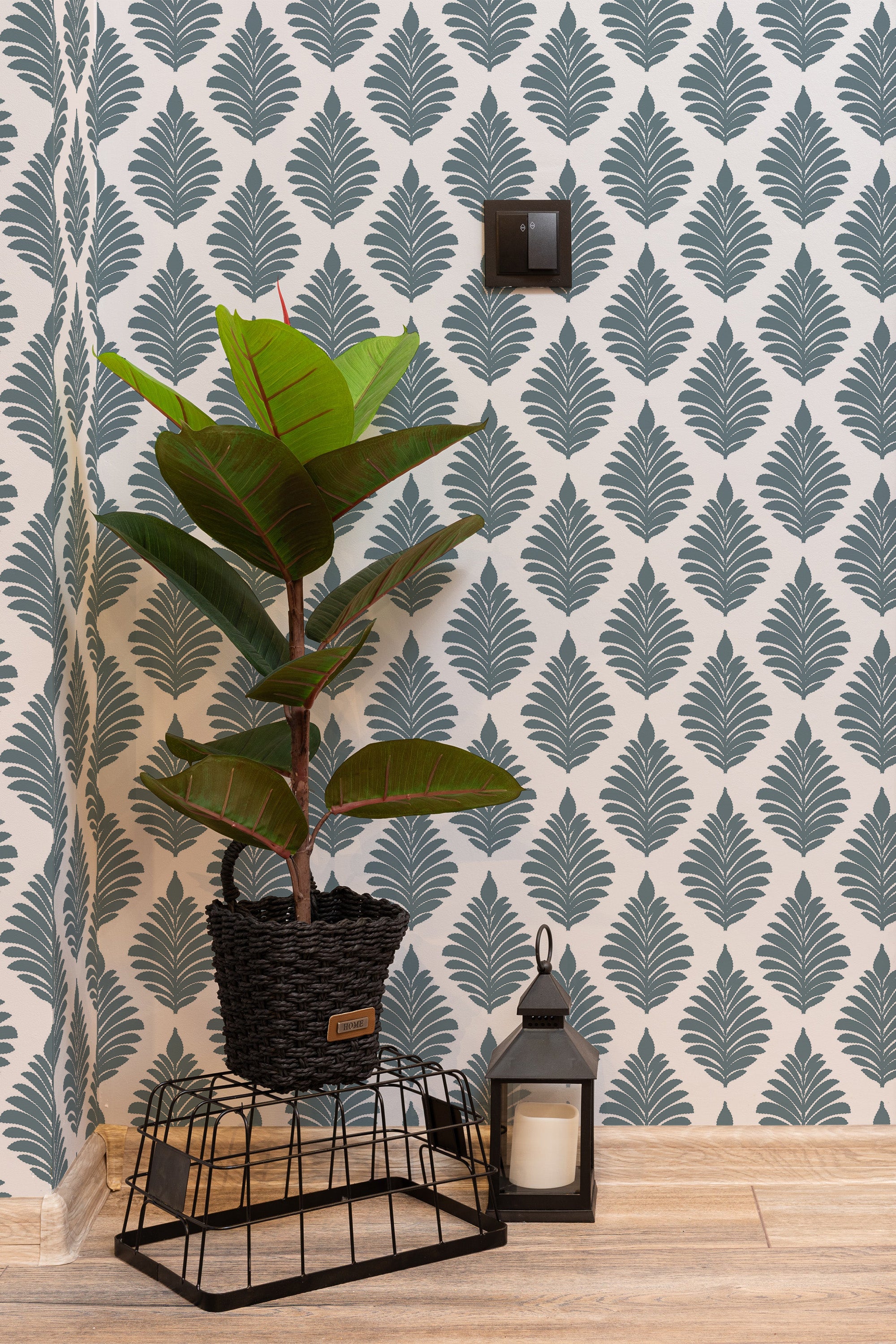 Self-adhesive French leaf pattern wallpaper in a muted teal color on a white background, adding a subtle yet elegant touch to the room's decor.