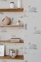 Self-adhesive wallpaper adorned with elegant swans and small crown accents on a white background.