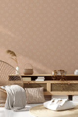 A room with wallpaper adorned with small, evenly spaced, neutral-colored star patterns on a light beige background, providing a subtle yet decorative touch. Traditional wallpaper.