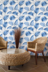 Self-adhesive wallpaper with a French palm leaf design in blue, set against a white background. The leaves are arranged in a vertical pattern, creating a tropical and elegant atmosphere.