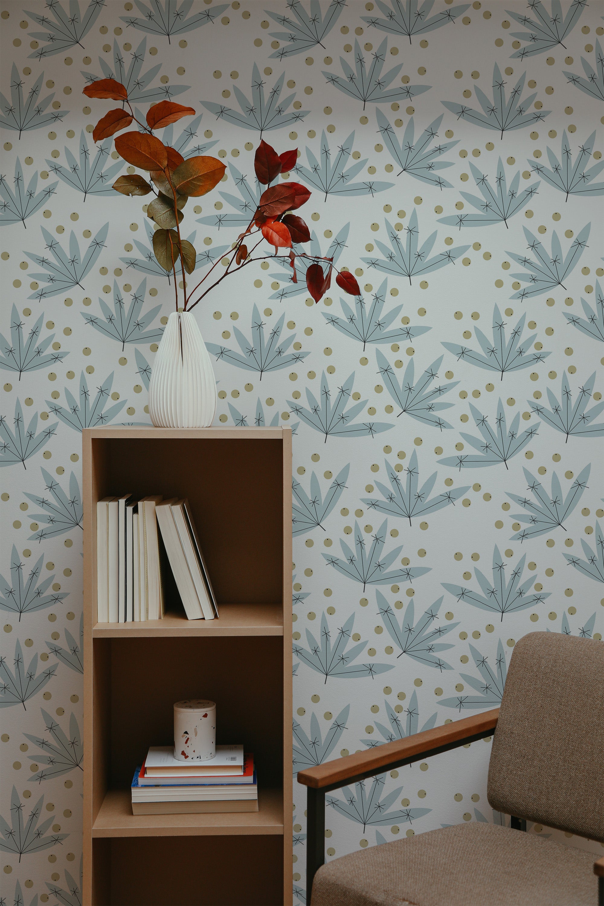Self-adhesive wallpaper with an abstract leaf design in soft blue and gray tones, paired with light yellow dots on a white background.