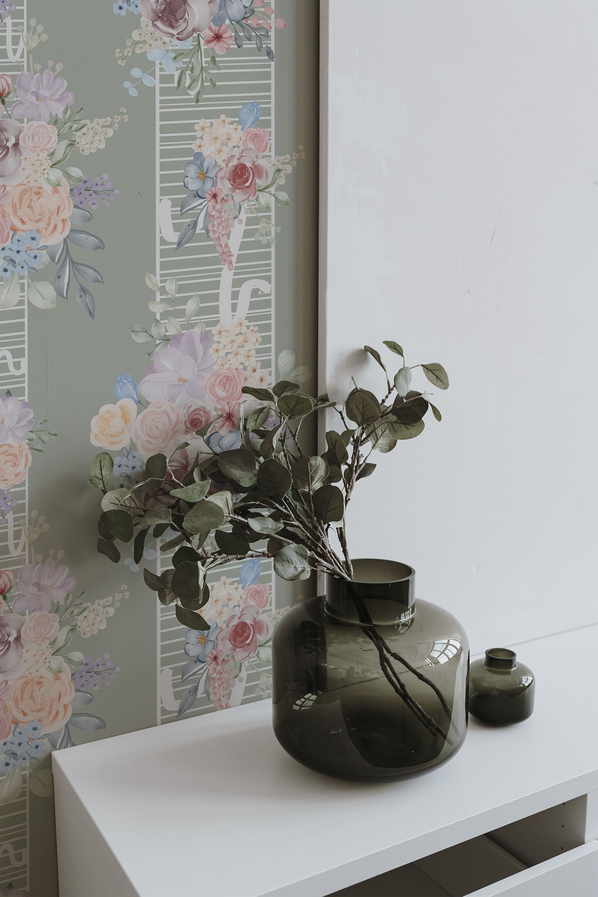 Self-adhesive Vintage rose stripe wallpaper with soft pastel florals and green background, complementing a white and grey minimalist interior.