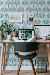 Self-adhesive Victorian wallpaper with a geometric pattern of stylized peacock feathers in shades of green and blue, creating a sophisticated and elegant backdrop.
