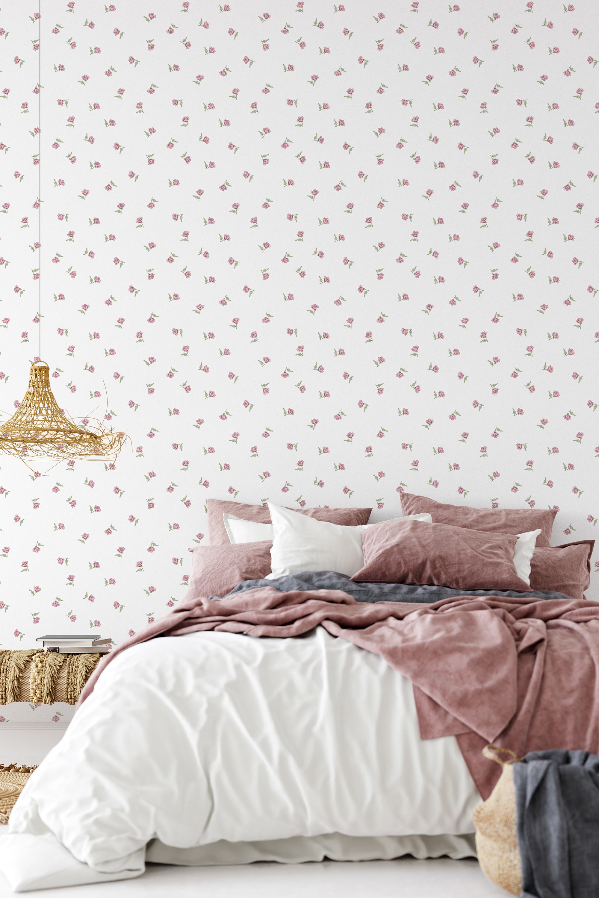 Wallpaper with a vintage rose design, featuring subtle, scattered pink roses on a white background in a bedroom with a soft, muted color palette that complements the traditional wallpaper.