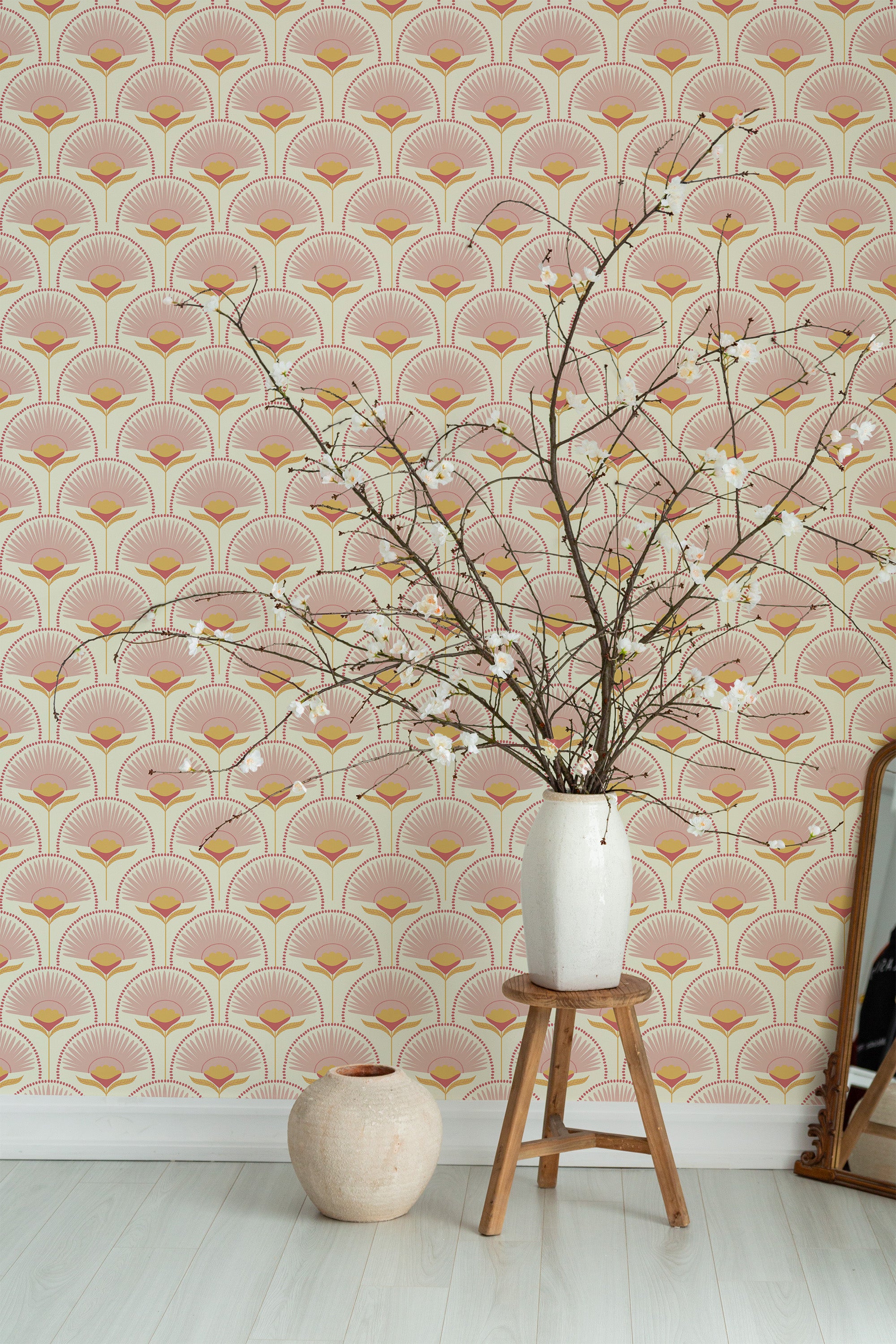 Self-adhesive retro floral wallpaper with a repeating pattern of stylized pink, orange, and yellow fan-shaped flowers, creating a vintage-inspired ambiance, complements the room's light-colored decor.