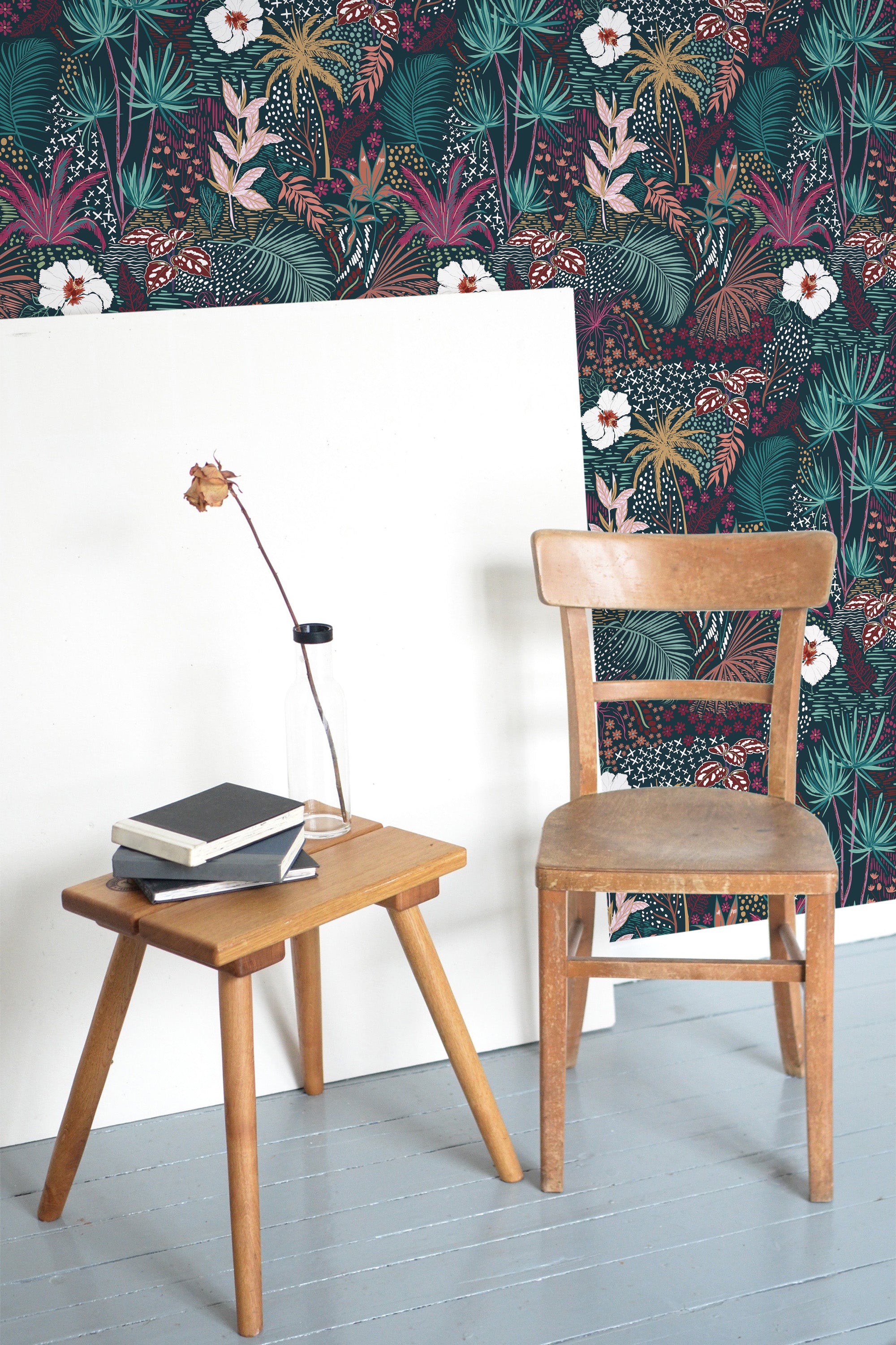 Self-adhesive dark forest wallpaper with a vibrant mix of tropical plants, large leaves, and exotic flowers in shades of green, pink, and white, adding a lush and bold atmosphere to the room.