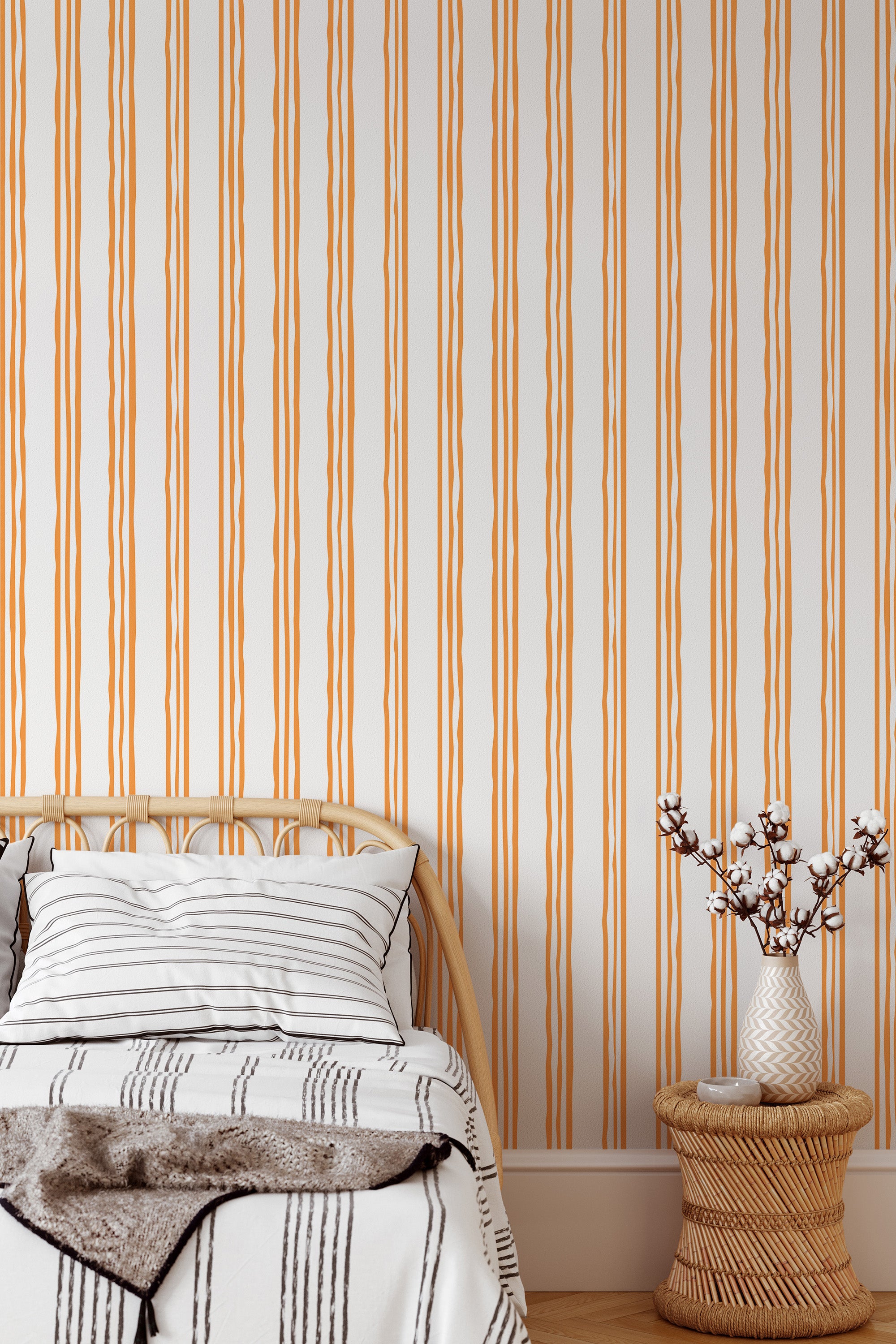Self-adhesive wallpaper with an aesthetic striped design in warm earthy tones, installed vertically in a cozy room setting.