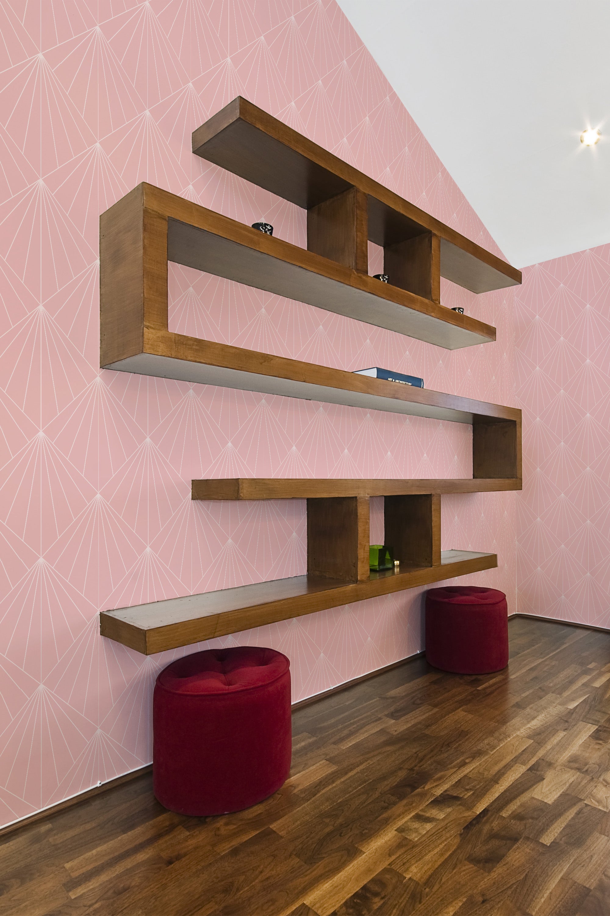 Geometric patterns with clean, sharp lines in a muted pink shade, creating a symmetrical and elegant design on the walls, enhancing the vintage ambiance of the space with traditional wallpaper.