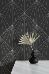 Self-adhesive Art Deco sun rays wallpaper with angular geometric patterns in light lines on a dark background.