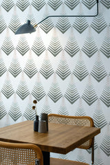 Self-adhesive wallpaper with a Colorful Art Deco design featuring a repeating pattern of geometric shapes resembling stylized trees, in shades of gray, white, and subtle hints of peach.