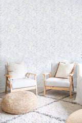 Room with wallpaper adorned with large floral line patterns in soft, muted tones, providing a cozy and traditional wallpaper.