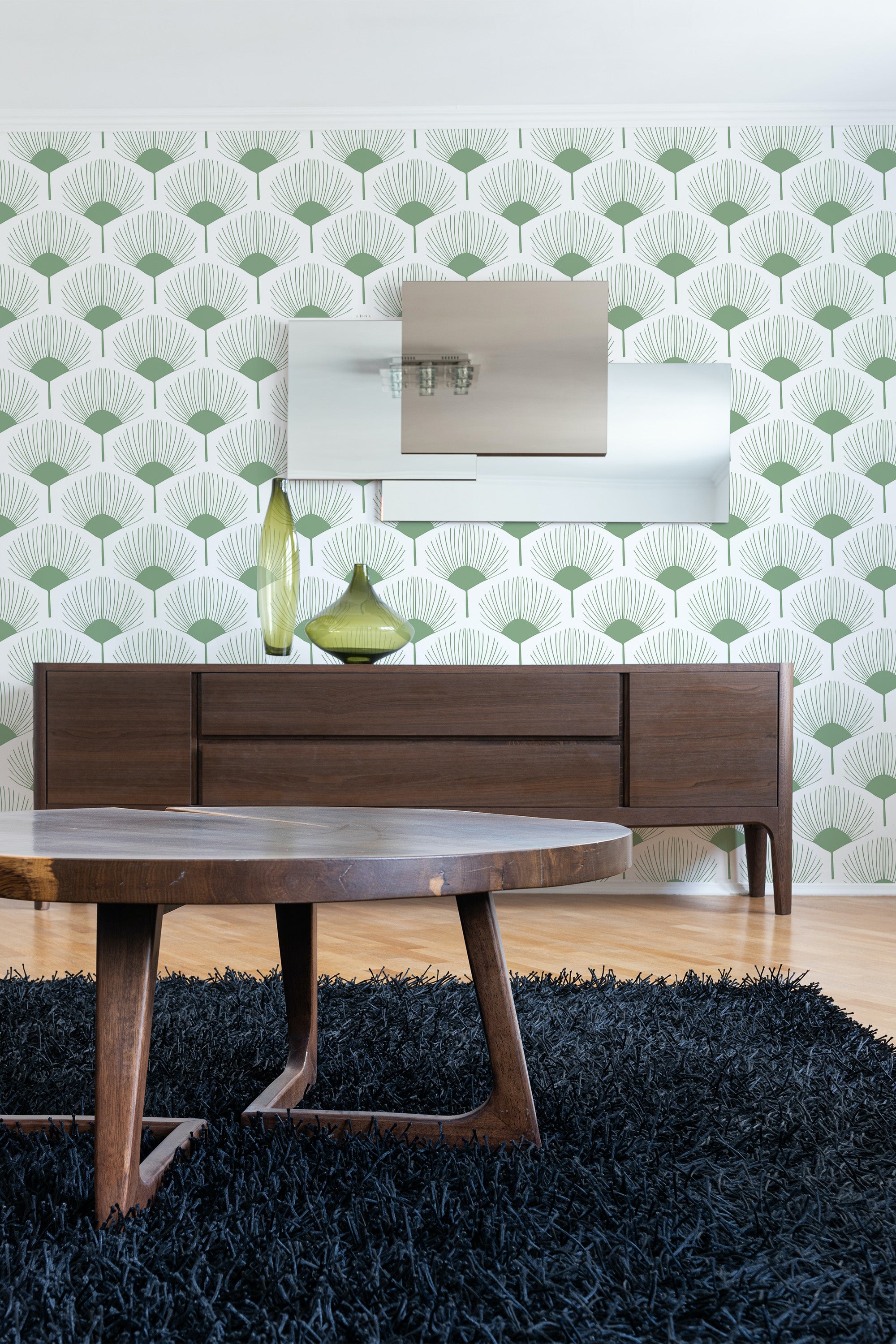 Green and white wallpaper with an abstract floral pattern, combining fan-shaped leaves and geometric elements, creating a fresh and contemporary look. Traditional wallpaper.