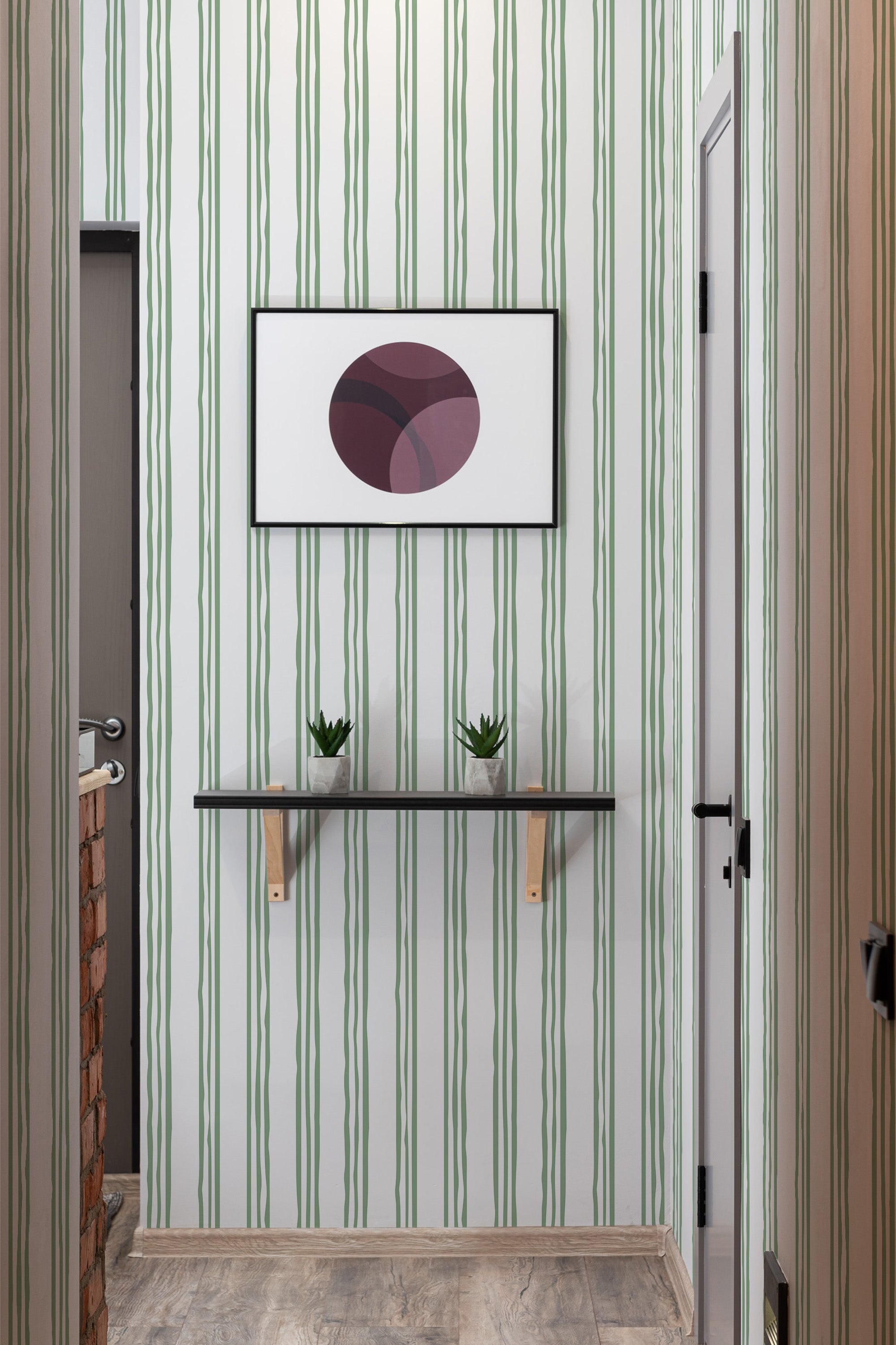 Vertical, evenly spaced green stripes on a light background with three varying line thicknesses forms a balanced pattern, conveying a classic and refined look, typical of traditional wallpaper.