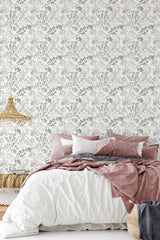 Elegant floral wallpaper with intricate, delicate patterns of blooming flowers and graceful vines in soft, muted tones, creating a timeless and classic aesthetic in the room. Traditional wallpaper.
