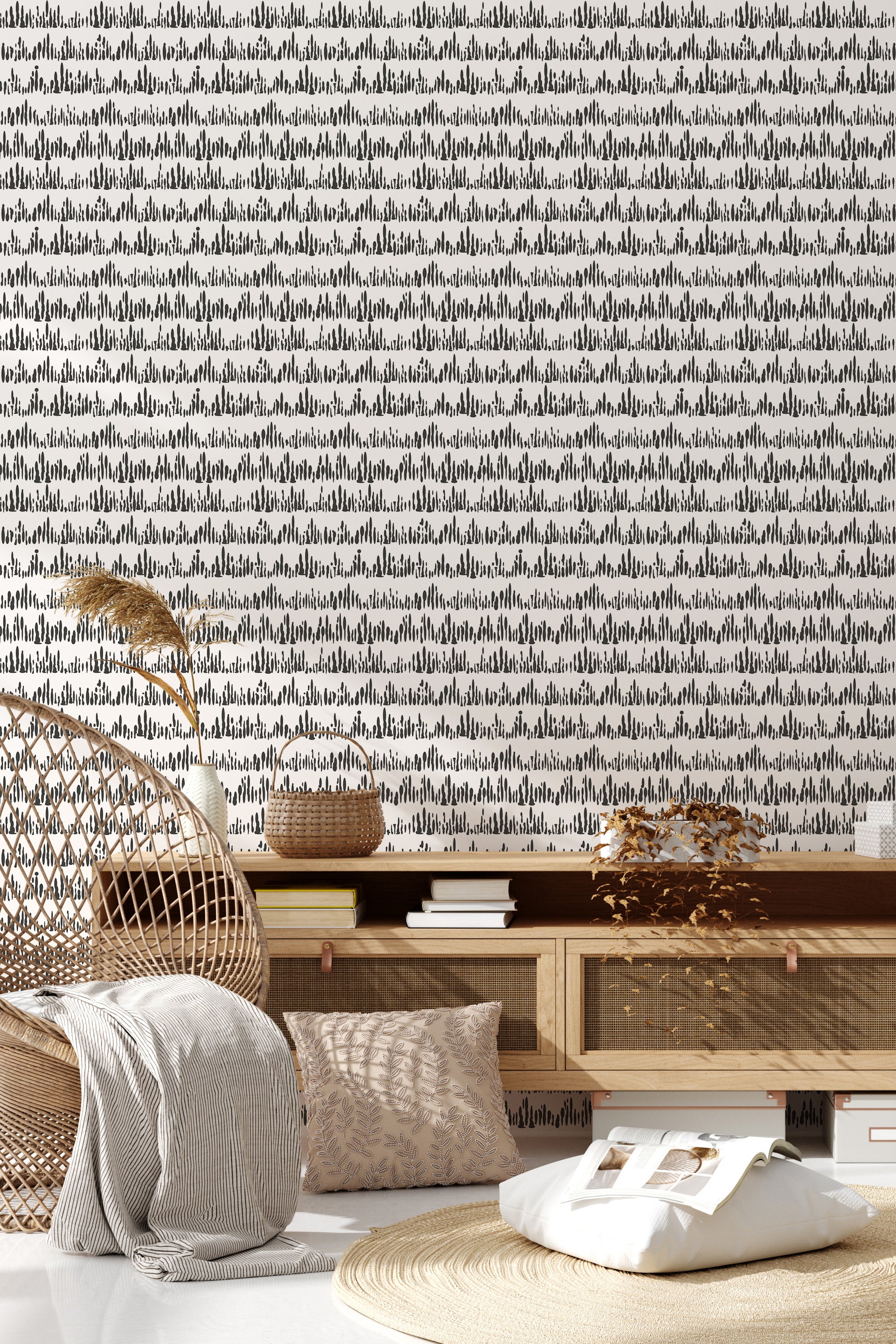 A wall covered with a Montezuma wallpaper design patterned with intricate, symmetrical black geometric shapes and lines on a light background, giving the room a modern yet classic atmosphere. Traditional wallpaper.