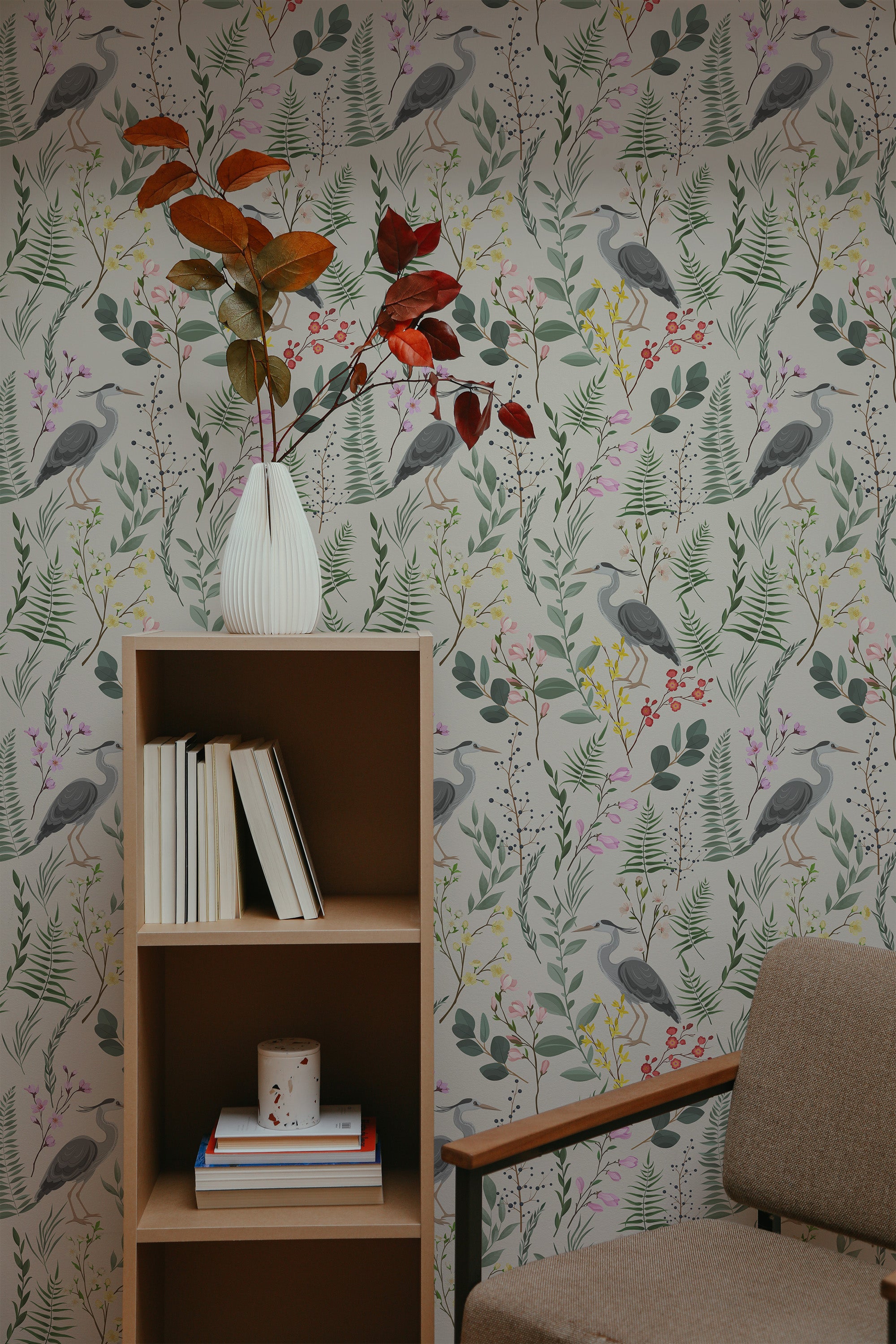 Self-adhesive wallpaper with a delicate bird design, surrounded by green leaves, various plants, and small pink flowers on a light background.