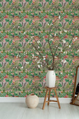 Self-adhesive Tropical wallpaper with vibrant green leaves, colorful birds, zebras, elephants, tigers, and other jungle elements on a lush background.