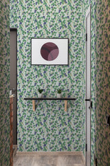 Wallpaper pattern with clusters of blue-blueberries and green leaves intertwined with stems on a subtle cream-colored background, giving the room a lively and fresh atmosphere. Traditional wallpaper.