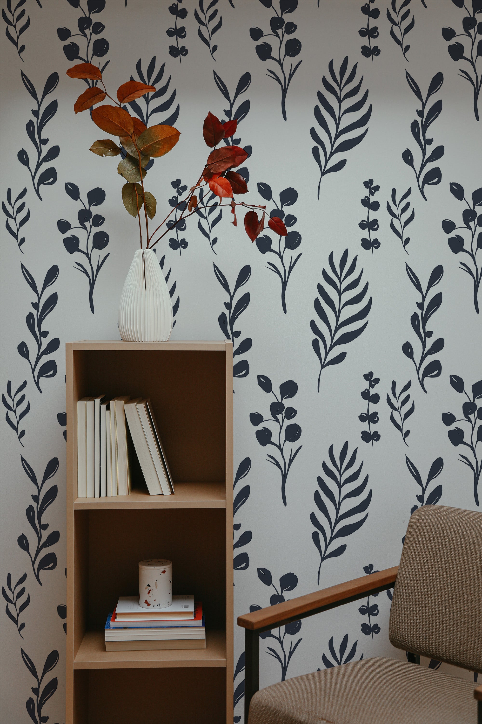 Self-adhesive wallpaper with a tropical leaves design, displaying dark blue botanical patterns against a light background.