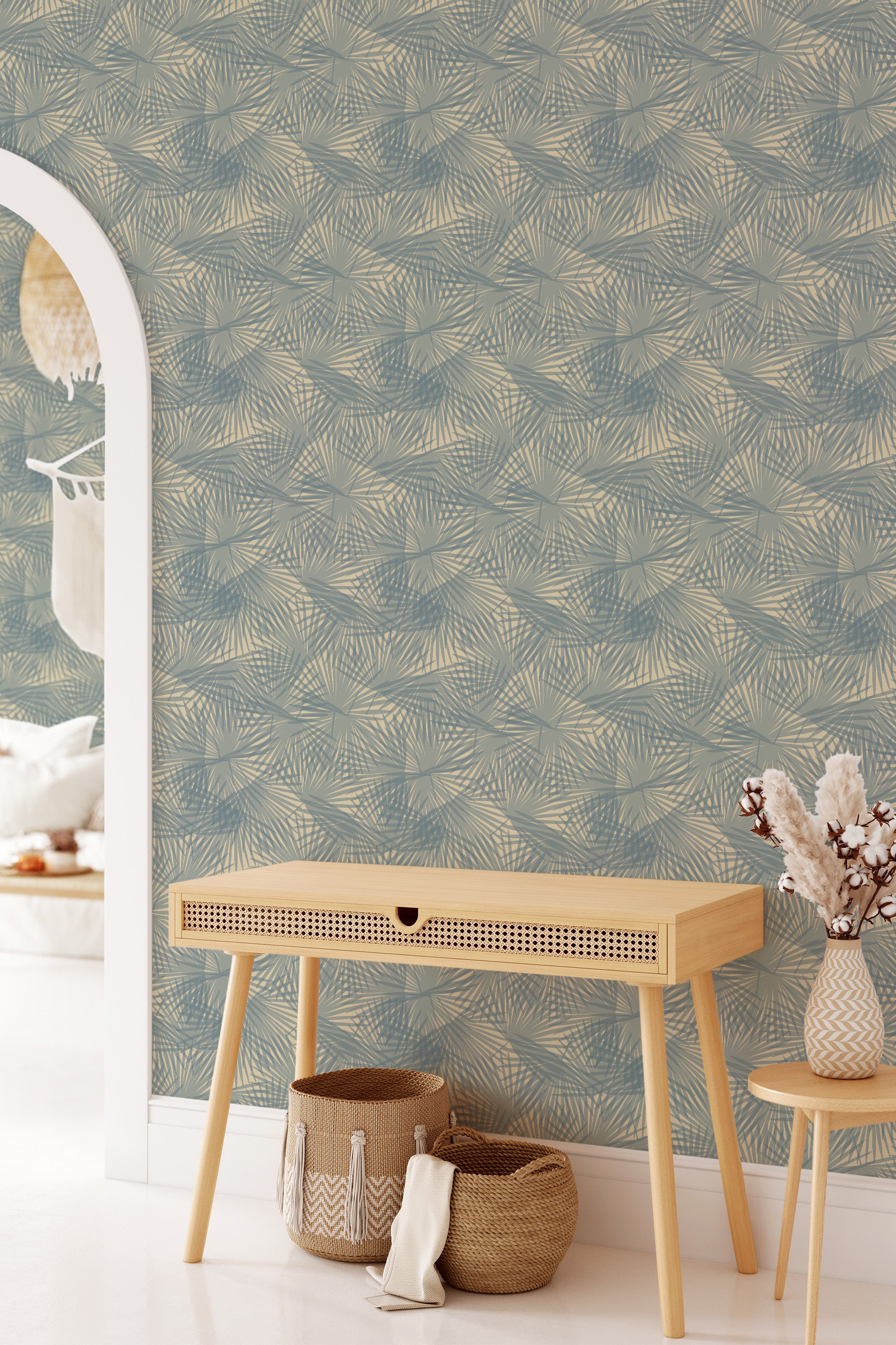 Wallpaper with a dark palm leaf pattern in a subtle mix of earthy tones, creating a natural, textured look that complements the light wooden furniture in the room. Traditional wallpaper.